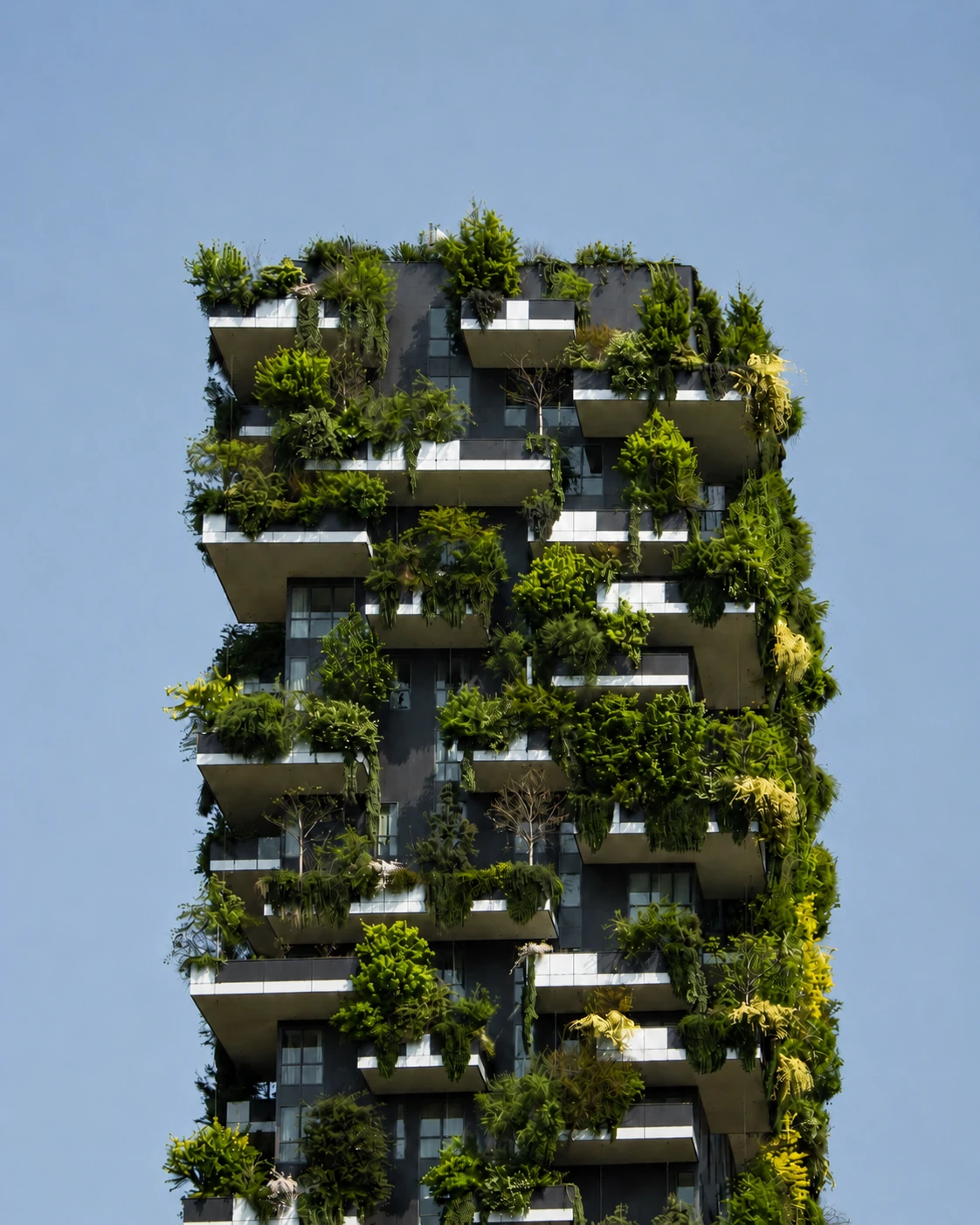 New-construction tower with planted balconies and green roof terraces, viewed from a drone-threat perspective to illustrate full-height building exposure.