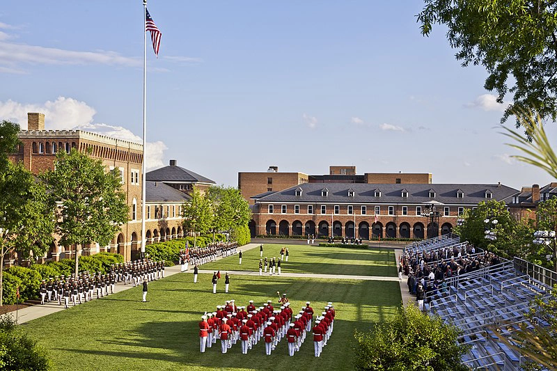 U.S. Marine Corps assemble outside of Marine Barracks Building 8 in Washington D.C. with U.S. flag