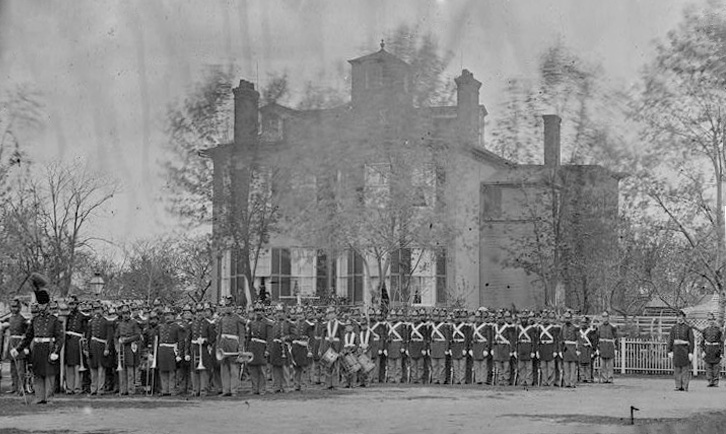 Historic black and white photo of U.S. Marine Corps assembled  in Marine Barracks Washington